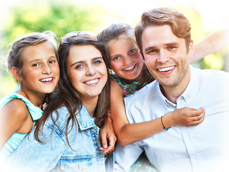 Cheerful family outdoors near Cornwall Dental Arts