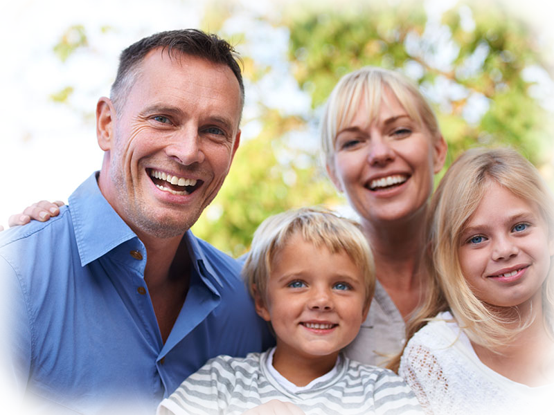 Happy family outdoors — answers to common dental questions