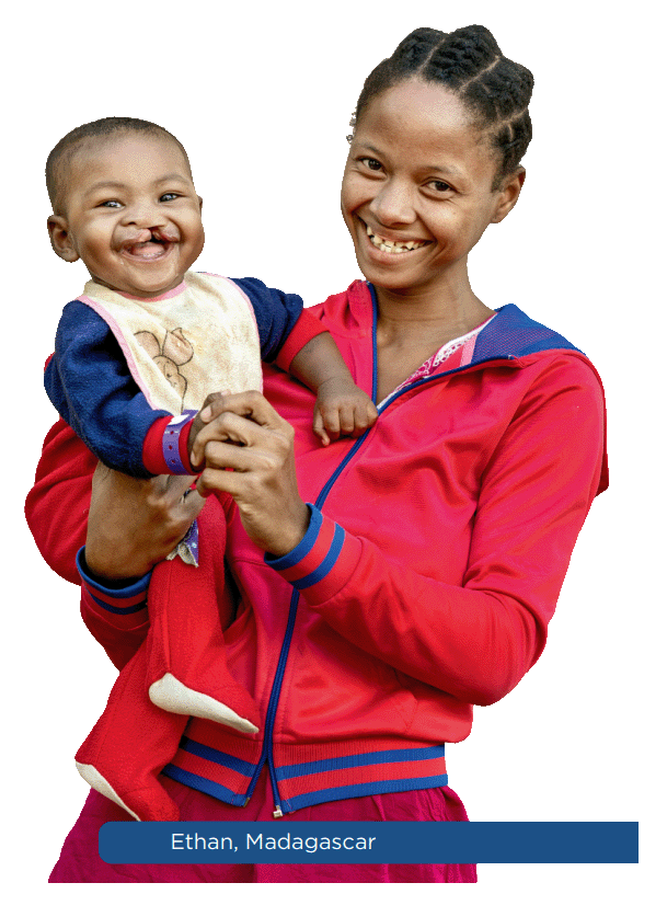 Smiling mother holding her child, Ethan from Madagascar
